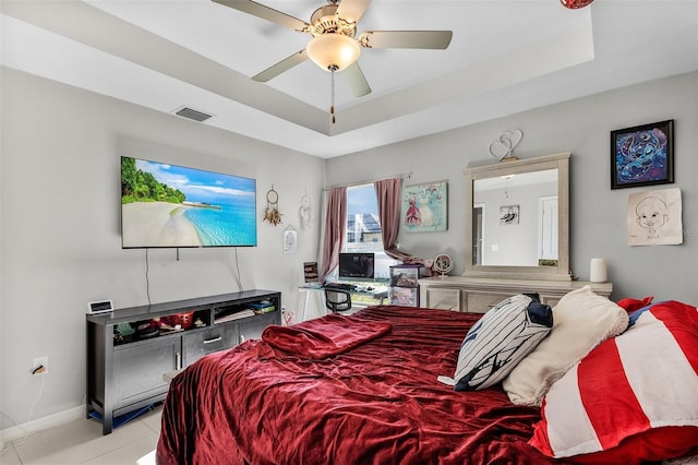 1731 NW 24th Pl, Cape Coral, FL 33993 - bedroom featuring a tray ceiling, tile patterned floors, and ceiling fan