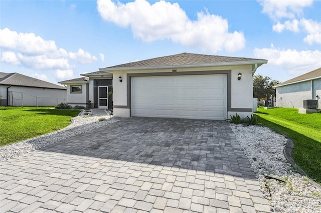 1731 NW 24th Pl, Cape Coral, FL 33993 - ranch-style house with stucco siding, decorative driveway, and a garage