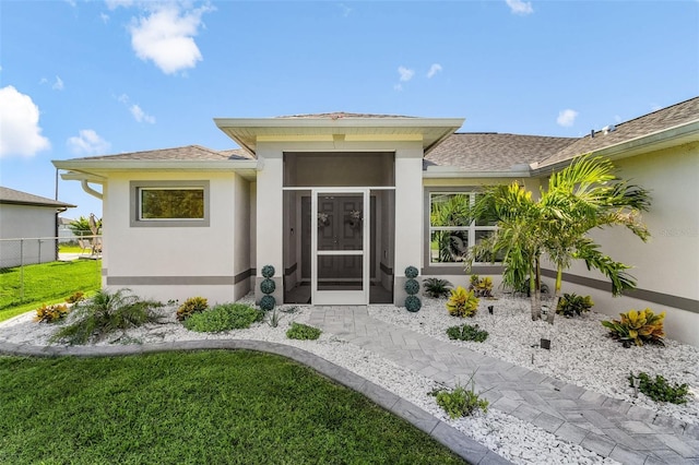 1731 NW 24th Pl, Cape Coral, FL 33993 - property entrance with stucco siding and roof with shingles