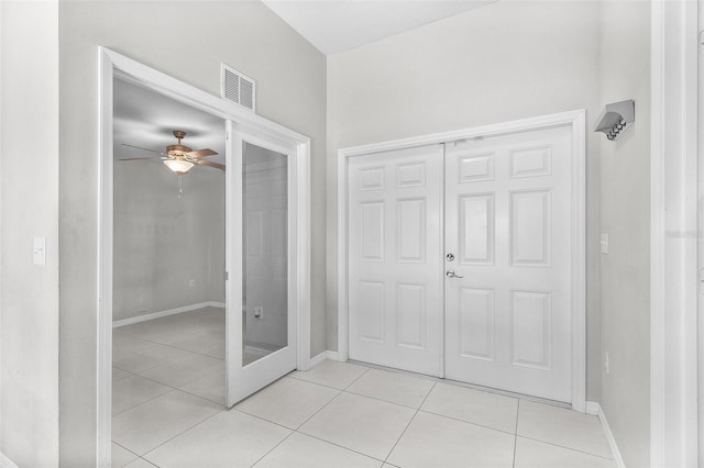 1731 NW 24th Pl, Cape Coral, FL 33993 - entryway with light tile patterned flooring and ceiling fan
