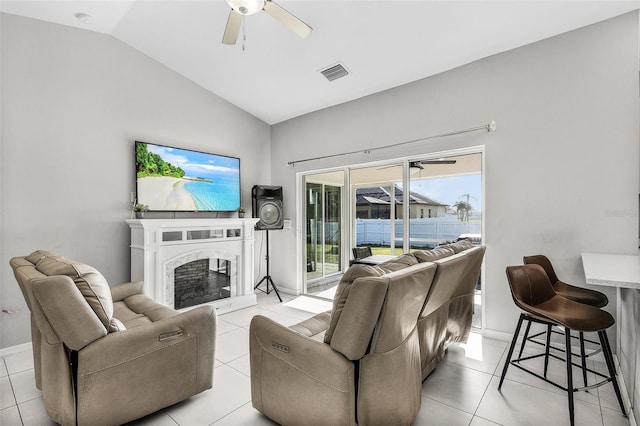 1731 NW 24th Pl, Cape Coral, FL 33993 - living room with lofted ceiling, a ceiling fan, light tile patterned floors, and a premium fireplace