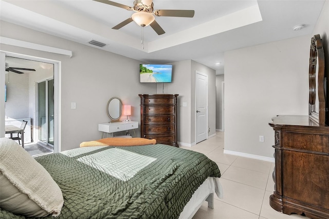 1731 NW 24th Pl, Cape Coral, FL 33993 - bedroom featuring light tile patterned floors, a raised ceiling, and a ceiling fan