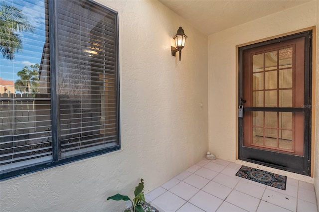 7150 Golden Eagle Ct Unit 213, Fort Myers, FL 33912 - view of exterior entry featuring stucco siding