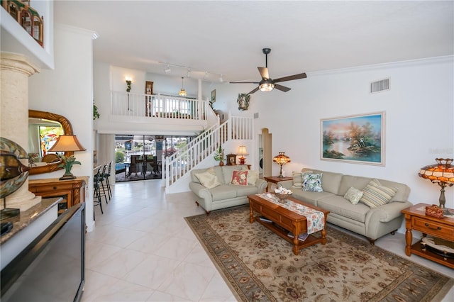 1418 Grebe Dr, Punta Gorda, FL 33950 - living room with a ceiling fan, stairs, a towering ceiling, and rail lighting