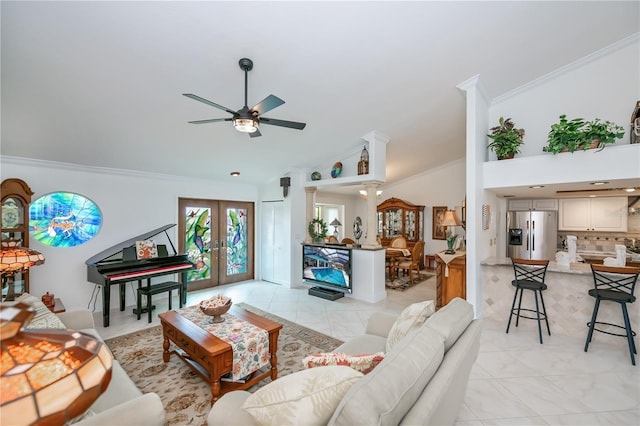 1418 Grebe Dr, Punta Gorda, FL 33950 - living room featuring vaulted ceiling, french doors, ornamental molding, ceiling fan, and light tile patterned floors