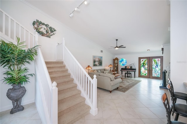 1418 Grebe Dr, Punta Gorda, FL 33950 - living room with a ceiling fan, stairway, vaulted ceiling, ornamental molding, and french doors