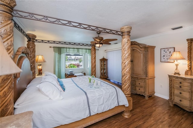 1418 Grebe Dr, Punta Gorda, FL 33950 - bedroom with dark wood finished floors, a textured ceiling, and ornamental molding