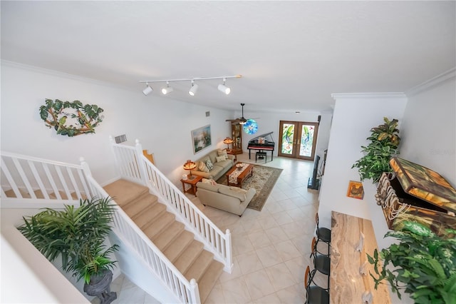 1418 Grebe Dr, Punta Gorda, FL 33950 - living room featuring stairs, a ceiling fan, and ornamental molding