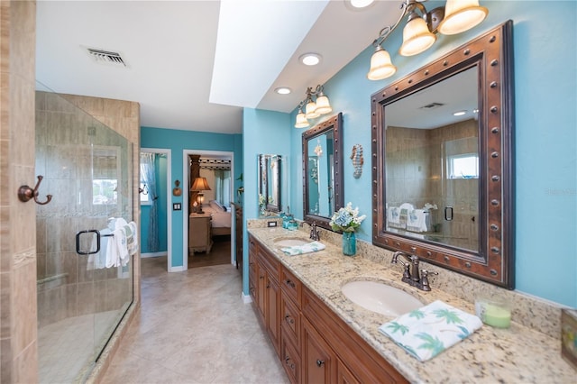 1418 Grebe Dr, Punta Gorda, FL 33950 - full bath featuring double vanity, a stall shower, tile patterned flooring, and connected bathroom