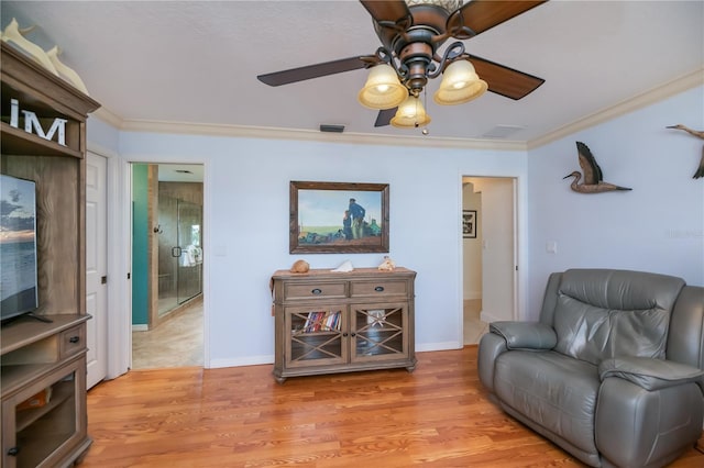 1418 Grebe Dr, Punta Gorda, FL 33950 - sitting room featuring crown molding, a ceiling fan, and light wood-type flooring