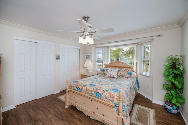 1418 Grebe Dr, Punta Gorda, FL 33950 - bedroom featuring multiple closets, crown molding, wood finished floors, and a ceiling fan