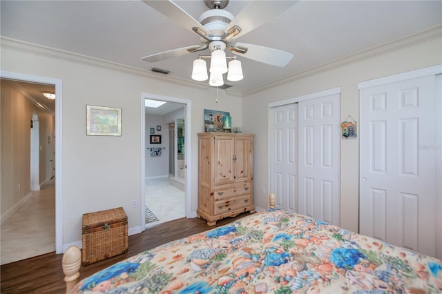 1418 Grebe Dr, Punta Gorda, FL 33950 - bedroom with crown molding, wood finished floors, a ceiling fan, and ensuite bath