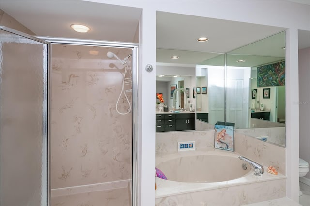 1418 Grebe Dr, Punta Gorda, FL 33950 - bathroom featuring a bath, a stall shower, vanity, and recessed lighting