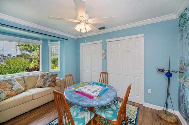 1418 Grebe Dr, Punta Gorda, FL 33950 - dining space with wood finished floors, a ceiling fan, and ornamental molding