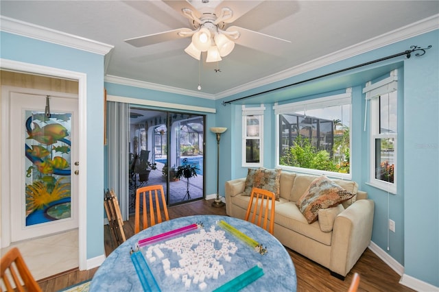 1418 Grebe Dr, Punta Gorda, FL 33950 - dining room featuring ceiling fan, ornamental molding, plenty of natural light, and wood finished floors