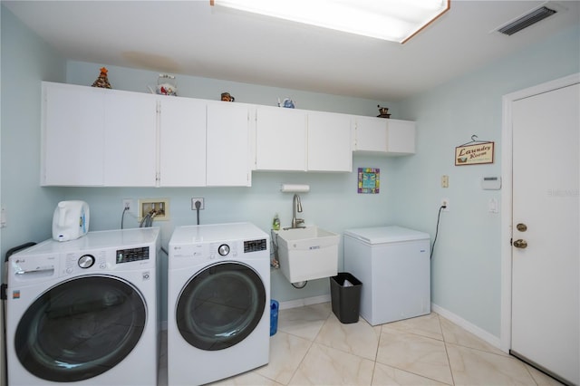 1418 Grebe Dr, Punta Gorda, FL 33950 - laundry room with cabinet space and separate washer and dryer