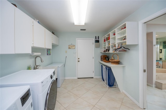 1418 Grebe Dr, Punta Gorda, FL 33950 - laundry area with washer and clothes dryer and cabinet space