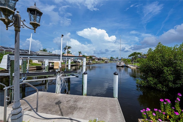 1418 Grebe Dr, Punta Gorda, FL 33950 - dock featuring boat lift and a water view