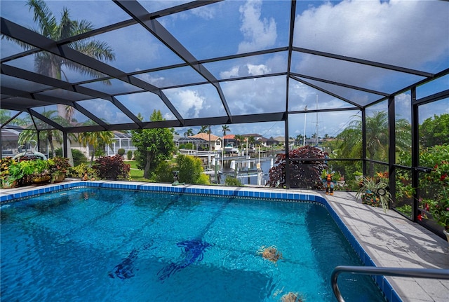 1418 Grebe Dr, Punta Gorda, FL 33950 - swimming pool with boat lift, a boat dock, and a lanai