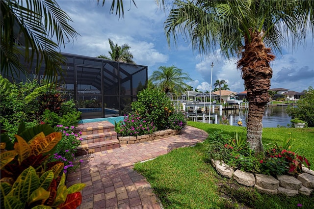 1418 Grebe Dr, Punta Gorda, FL 33950 - view of yard with a water view, a lanai, a pool, a dock, and boat lift