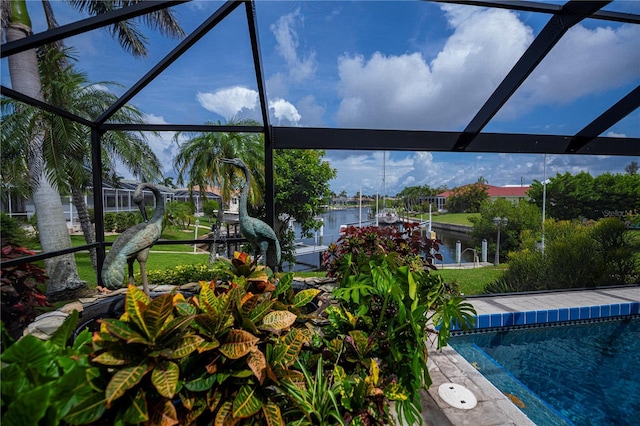 1418 Grebe Dr, Punta Gorda, FL 33950 - outdoor pool with a water view, a dock, glass enclosure, and boat lift