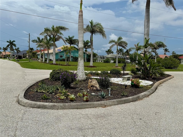 1418 Grebe Dr, Punta Gorda, FL 33950 - surrounding community with a lawn and a residential view