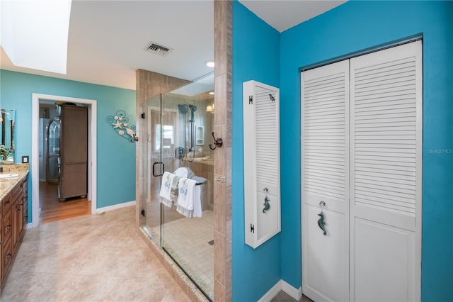 1418 Grebe Dr, Punta Gorda, FL 33950 - bathroom with a closet, vanity, a shower stall, and tile patterned flooring