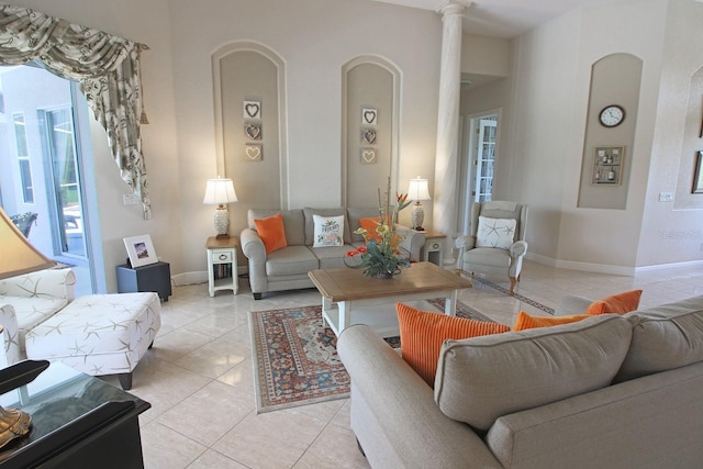 260 Rotonda Blvd E, Rotonda West, FL 33947 - living area featuring arched walkways and light tile patterned floors