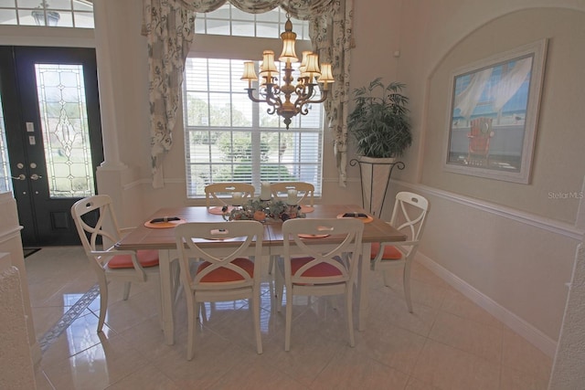260 Rotonda Blvd E, Rotonda West, FL 33947 - dining space featuring a chandelier and light tile patterned floors