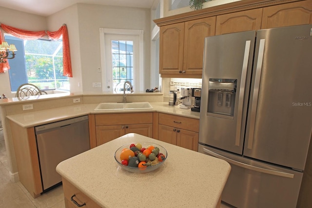 260 Rotonda Blvd E, Rotonda West, FL 33947 - kitchen featuring appliances with stainless steel finishes, light countertops, a peninsula, and light tile patterned flooring