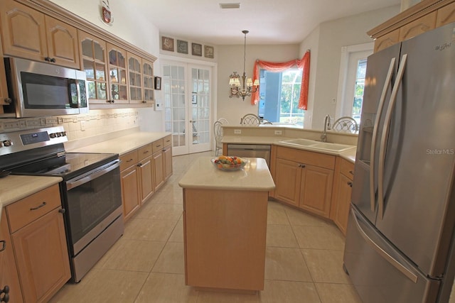 260 Rotonda Blvd E, Rotonda West, FL 33947 - kitchen with appliances with stainless steel finishes, light countertops, and decorative backsplash
