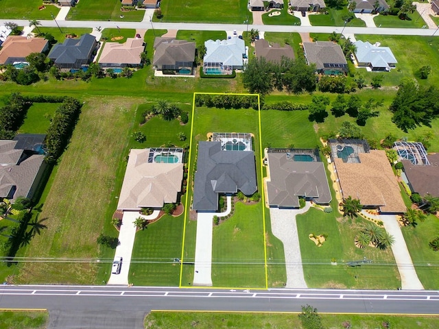 260 Rotonda Blvd E, Rotonda West, FL 33947 - aerial perspective of suburban area featuring property parcel outlined
