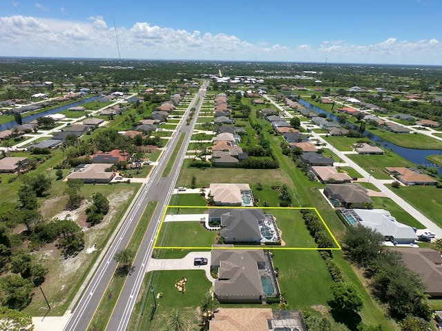 260 Rotonda Blvd E, Rotonda West, FL 33947 - aerial view of residential area with a nearby body of water and property boundaries highlighted