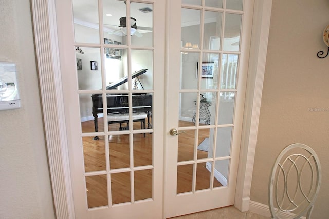 260 Rotonda Blvd E, Rotonda West, FL 33947 - detailed view of a ceiling fan and french doors