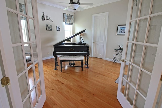 260 Rotonda Blvd E, Rotonda West, FL 33947 - sitting room featuring french doors, ornamental molding, light wood-style floors, and a ceiling fan