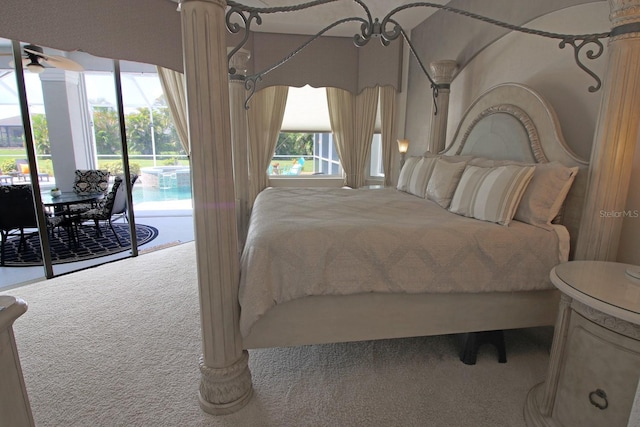 260 Rotonda Blvd E, Rotonda West, FL 33947 - carpeted bedroom with access to exterior