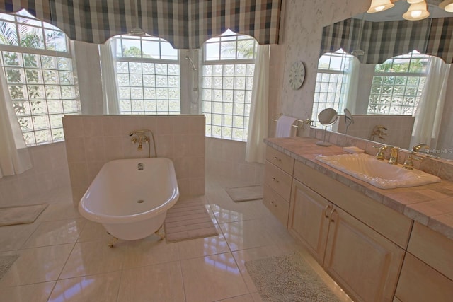 260 Rotonda Blvd E, Rotonda West, FL 33947 - full bath featuring tile patterned flooring, vanity, walk in shower, a freestanding bath, and wallpapered walls