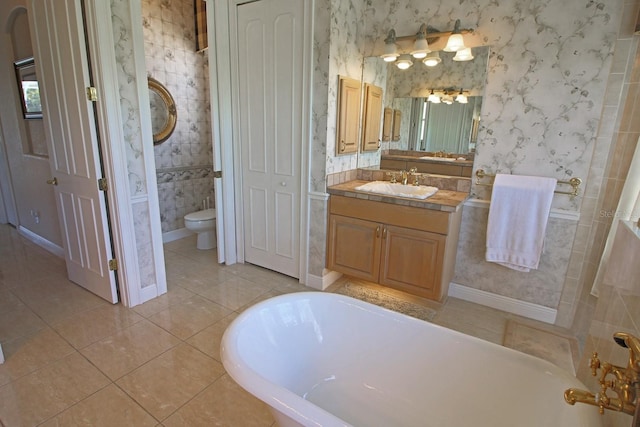 260 Rotonda Blvd E, Rotonda West, FL 33947 - bathroom with wallpapered walls, a freestanding tub, tile patterned flooring, and vanity