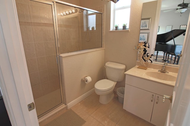 260 Rotonda Blvd E, Rotonda West, FL 33947 - bathroom featuring vanity, a stall shower, tile patterned floors, a textured wall, and a ceiling fan