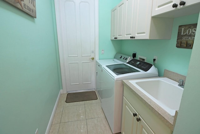 260 Rotonda Blvd E, Rotonda West, FL 33947 - washroom with cabinet space, independent washer and dryer, and light tile patterned floors