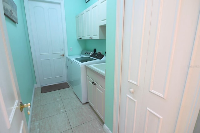 260 Rotonda Blvd E, Rotonda West, FL 33947 - laundry room featuring cabinet space, independent washer and dryer, and light tile patterned floors