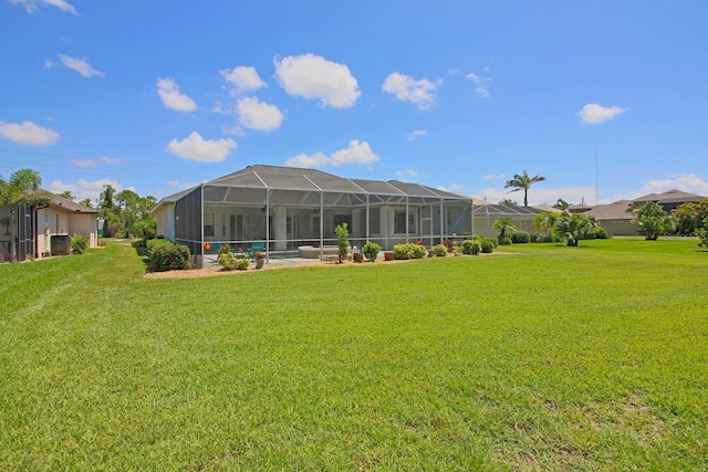 260 Rotonda Blvd E, Rotonda West, FL 33947 - view of grassy yard featuring glass enclosure
