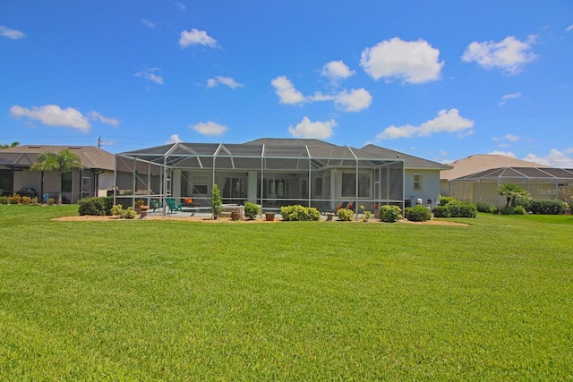 260 Rotonda Blvd E, Rotonda West, FL 33947 - rear view of house featuring a lawn and a lanai