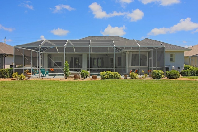 260 Rotonda Blvd E, Rotonda West, FL 33947 - rear view of house with a yard, a patio area, an outdoor pool, and glass enclosure