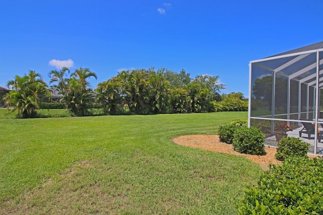 260 Rotonda Blvd E, Rotonda West, FL 33947 - view of grassy yard with glass enclosure