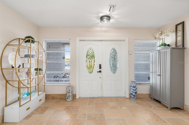 123 Annapolis Ln, Rotonda West, FL 33947 - entryway with stone tile flooring
