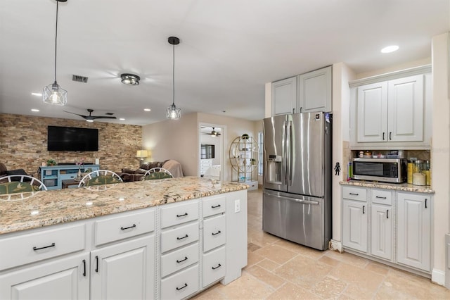 123 Annapolis Ln, Rotonda West, FL 33947 - kitchen featuring stainless steel appliances, a ceiling fan, open floor plan, hanging light fixtures, and recessed lighting