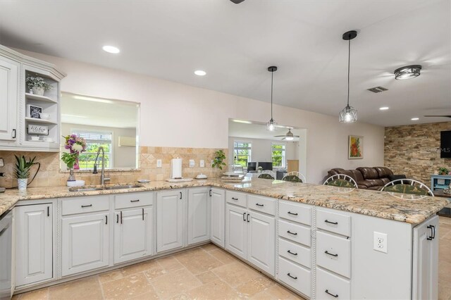 123 Annapolis Ln, Rotonda West, FL 33947 - kitchen with ceiling fan, open floor plan, backsplash, healthy amount of natural light, and recessed lighting