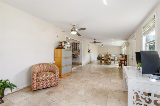 123 Annapolis Ln, Rotonda West, FL 33947 - office featuring stone tile flooring and a ceiling fan