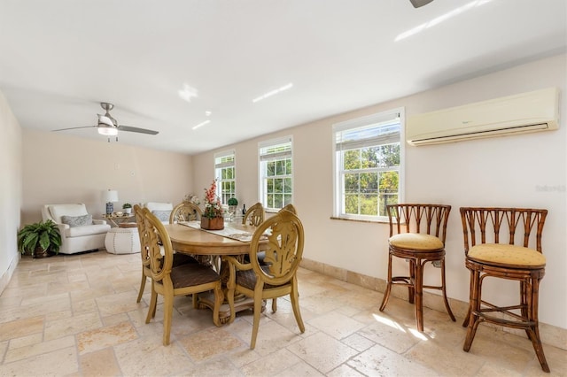 123 Annapolis Ln, Rotonda West, FL 33947 - dining area with a wall mounted AC, stone tile flooring, and ceiling fan